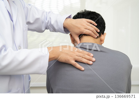 Physical therapy, Asian therapist doctor treat perform pain young man in hospital. Physical therapy, Asian therapist doctor treat perform pain young man in hospital. 136669571