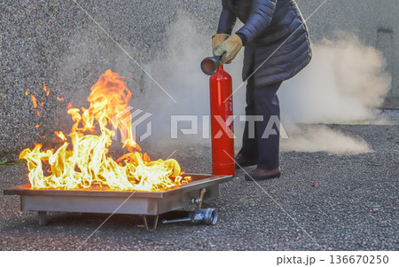 corporate safety - exercise during a firefighting course corporate safety - exercise during a firefighting course 136670250