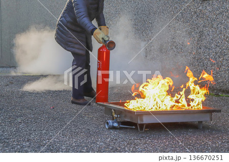 corporate safety - exercise during a firefighting course 136670251