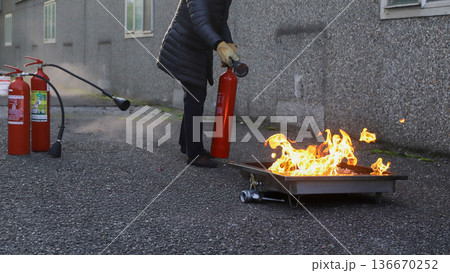 corporate safety - exercise during a firefighting course 136670252