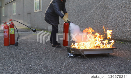 corporate safety - exercise during a firefighting course corporate safety - exercise during a firefighting course 136670254