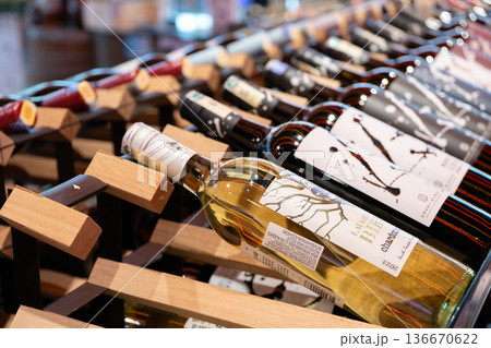 Display of assorted wine bottles in a retail shelf Display of assorted wine bottles in a retail shelf 136670622