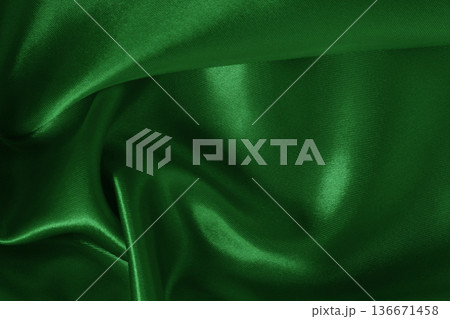 Dark green fabric cloth texture for background and design art work, beautiful crumpled pattern of silk or linen. 136671458