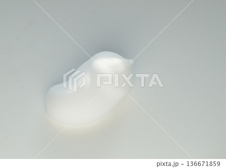 Drops of shaving foam, mousse or hair styling foam on white background Drops of shaving foam, mousse or hair styling foam on white background 136671859