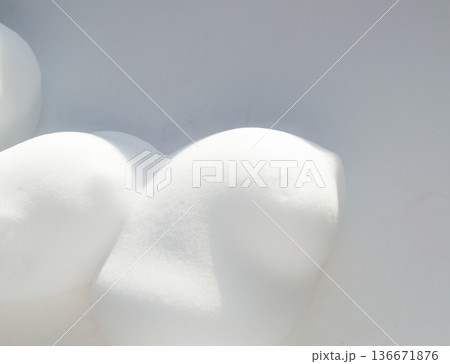 Drops of shaving foam, mousse or hair styling foam on white background 136671876