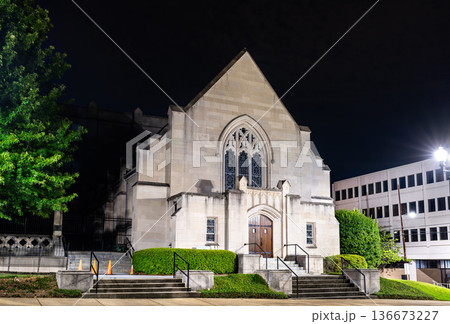 Galloway United Methodist Church chapel in Jackson Mississippi. Historic stone religious architecture features a Gothic Revival facade with a pointed arch window Galloway United Methodist Church chapel in Jackson Mississippi. Historic stone religious architecture features a Gothic Revival facade with a pointed arch window 136673227