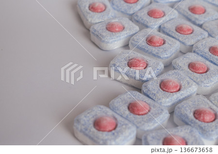 Minimalist design: cleaning tablets for dishwashing on a pure white background Minimalist design: cleaning tablets for dishwashing on a pure white background 136673658