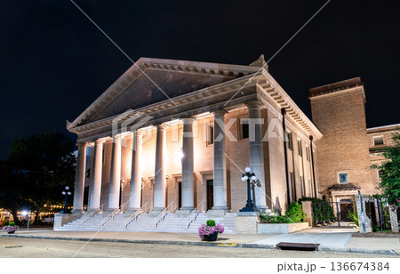 Galloway Memorial United Methodist Church is located in Jackson, Mississippi, USA. Historic Neoclassical architecture features the illuminated portico and massive stone columns under a dark night sky 136674384