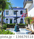Decorative fountain with multiple tiers in Puerto de Mogan, Gran Canaria, surrounded by a tiled basin 136676518