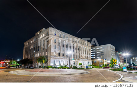 James O. Eastland Federal Building in Jackson, Mississippi. Historic Art Deco United States Post Office and Court House features a limestone facade facing the West Capitol Street roundabout at night James O. Eastland Federal Building in Jackson, Mississippi. Historic Art Deco United States Post Office and Court House features a limestone facade facing the West Capitol Street roundabout at night 136677132