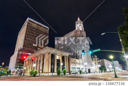Historic architecture in downtown Jackson, Mississippi. The Lamar Life clock tower (right) and Neoclassical First National Bank (center) stand near the Capital Towers skyscraper (left) at night Historic architecture in downtown Jackson, Mississippi. The Lamar Life clock tower (right) and Neoclassical First National Bank (center) stand near the Capital Towers skyscraper (left) at night 136677136