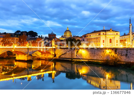 Image of St. Peter's Basilica, Ponte Sant Angelo and Tiber River at dark night in Rome, Italy. Sant' Angelo Bridge and St. Peter's cathedral at sunset in Vatican City, Rome, Italy. Image of St. Peter's Basilica, Ponte Sant Angelo and Tiber River at dark night in Rome, Italy. Sant' Angelo Bridge and St. Peter's cathedral at sunset in Vatican City, Rome, Italy. 136677846
