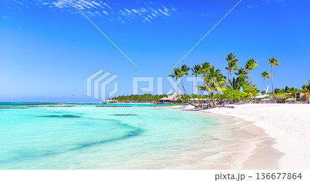 Panorama of beautiful white sand beach and turquoise water of Caribbean sea in Cap Cana, Dominican Republic. Summer beach holiday background 136677864