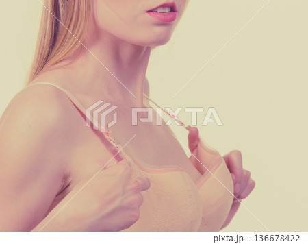 Female wearing too big bra Female wearing too big bra 136678422