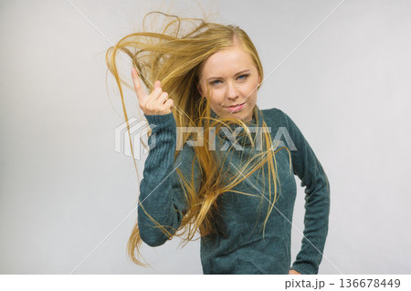 Woman pointing finger displeased 136678449