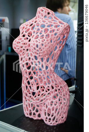 Form printed on 3D printer from plastic. Sculpture of a female torso made using 3D printing from filament. Additive manufacturing. Layer-by-layer application of material. 3D printing FDM technologies 136679046