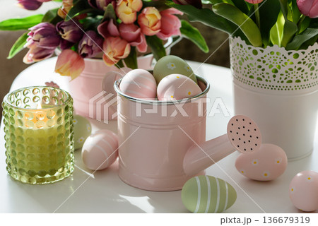 Easter Table with Tulip Bouquets, Eggs, Candles and Festive Decor. Cozy Spring Arrangement 136679319