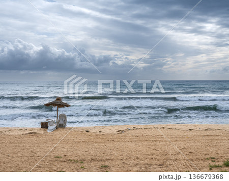 Serene Solitude: Dramatic Skies over Empty Tunisian Shores 136679368
