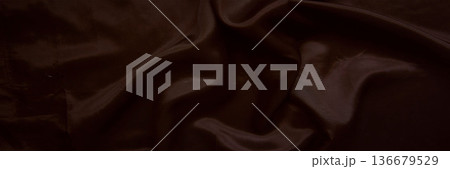 Elegant dark chocolate brown silk fabric with smooth satin ripples 136679529