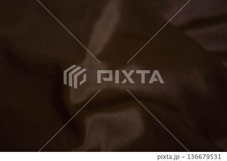 Elegant dark chocolate brown silk fabric with smooth satin ripples Elegant dark chocolate brown silk fabric with smooth satin ripples 136679531