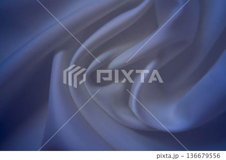 Elegant white silk fabric with deep blue shadows 136679556
