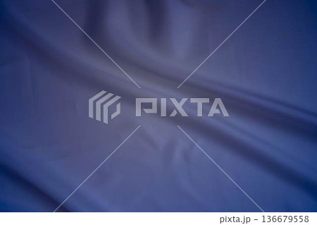 Elegant white silk fabric with deep blue shadows Elegant white silk fabric with deep blue shadows 136679558