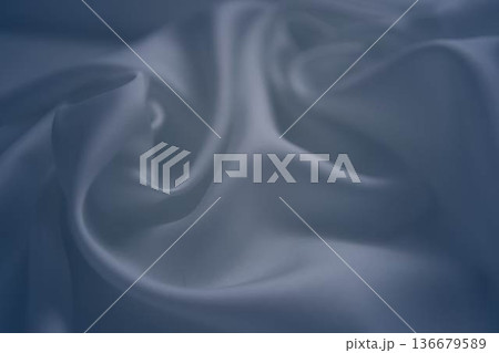 White and cashmere blue silk fabric with elegant flowing folds White and cashmere blue silk fabric with elegant flowing folds 136679589