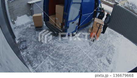 Team Unload Van Using Pallet Jack and Trolley Team Unload Van Using Pallet Jack and Trolley 136679668