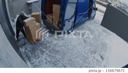 Team Unload Van Using Pallet Jack and Trolley 136679672