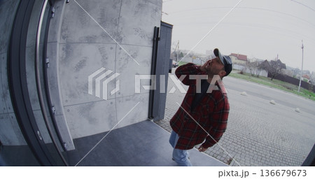 Intoxicated Adult Man Acting Erratically and Disoriented on Porch 136679673