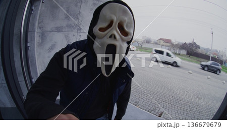 Man Wearing Ghost Mask Approaches Front Door, Presses Doorbell, Starts Dancing Playfully 136679679