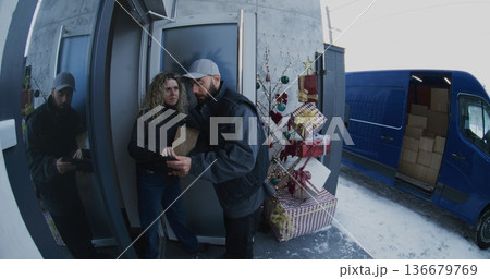 Bearded Courier Hands Over Parcel and Manages Electronic Signature Process Bearded Courier Hands Over Parcel and Manages Electronic Signature Process 136679769