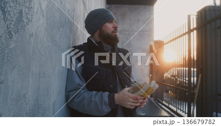 Man Leaning Against Wall Catch Breath After Intense Work Man Leaning Against Wall Catch Breath After Intense Work 136679782