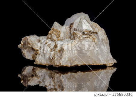 Macro mineral stone Snow quartz with calcite on a black background Macro mineral stone Snow quartz with calcite on a black background 136680336