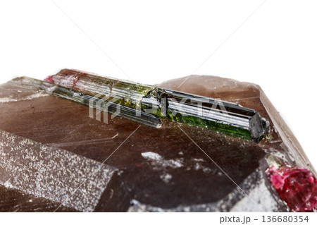 Macro mineral tourmaline stone in quartz on a white background 136680354