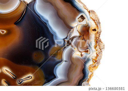 Macro mineral stone Yellow, brown Agate breed a white background Macro mineral stone Yellow, brown Agate breed a white background 136680381