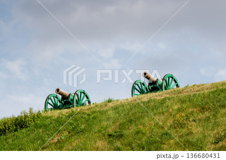 The ancient guns stand on the mountain The ancient guns stand on the mountain 136680431