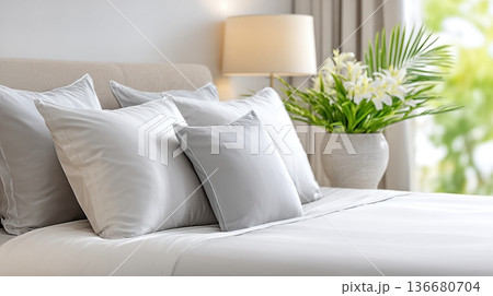 Relaxing Space With Soft Pillows and Elegant Decor in a Cozy Bedroom Setting During Daylight 136680704