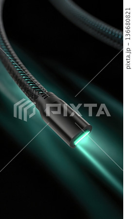 Closeup of Charging Cable With Soft Green Light Glow on a Dark Background During Night Time Closeup of Charging Cable With Soft Green Light Glow on a Dark Background During Night Time 136680821