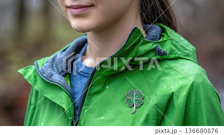 Closeup View of Shamrock Pin Shown on Green Jacket During Spring Outdoor Activity 136680876