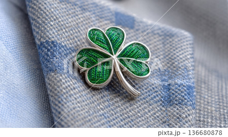 Closeup View of a Shamrock Pin Secured to a Jacket on a Sunny Day at an Outdoor Gathering 136680878