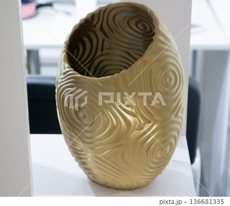 Art form printed on 3D printer from plastic. Art shape made using 3D printing from filament. Additive manufacturing. Layer-by-layer application of material. 3D printing technologies. FDM technology Art form printed on 3D printer from plastic. Art shape made using 3D printing from filament. Additive manufacturing. Layer-by-layer application of material. 3D printing technologies. FDM technology 136681335