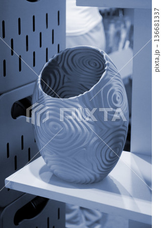 Art form printed on 3D printer from plastic. Art shape made using 3D printing from filament. Additive manufacturing. Layer-by-layer application of material. 3D printing technologies. FDM technology 136681337