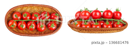 Cherry tomato bunch in a wicker basket isolated on white background. Top view. Flat lay Cherry tomato bunch in a wicker basket isolated on white background. Top view. Flat lay 136681476