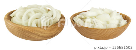 Onion slices and chopped in a wooden bowl isolated on a white background. Onion slices and chopped in a wooden bowl isolated on a white background. 136681502