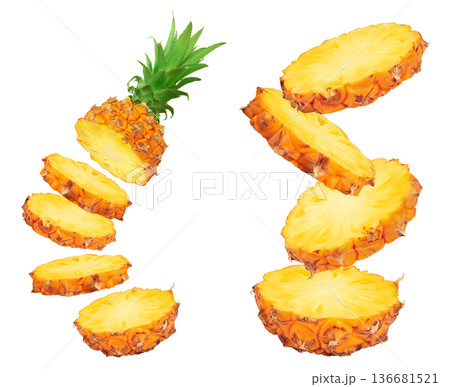 falling pineapple slices isolated on white background with full depth of field 136681521