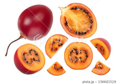 Fresh tamarillo fruit slices with leaves isolated on white background. Top view. Flat lay. Set or collection 136681529