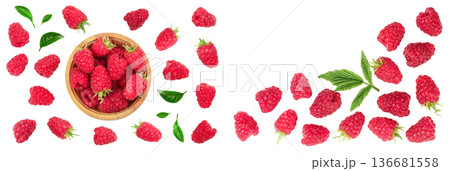 raspberries in wooden bowl with leaves isolated on white background with copy space for your text. Top view. Flat lay pattern 136681558