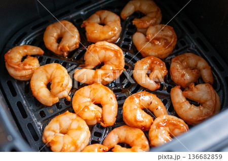 Perfectly Cooked Shrimp in an Air Fryer Basket Perfectly Cooked Shrimp in an Air Fryer Basket 136682859
