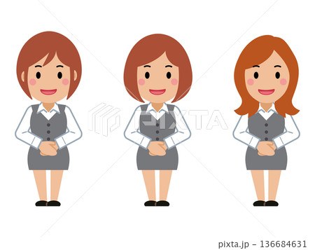 両手を前で重ね、笑顔のグレー事務服の若い女性 両手を前で重ね、笑顔のグレー事務服の若い女性 136684631